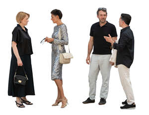 men and women standing and talking at a party