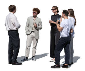 group of young people at a social event standing and talking