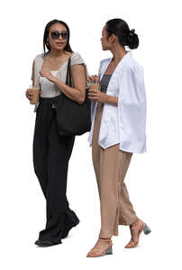 two asian women with coffee drinks walking