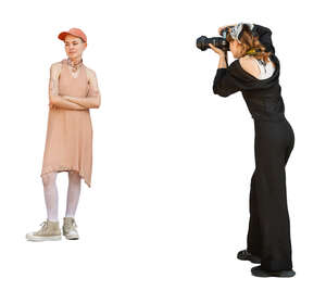 woman taking pictures of another woman