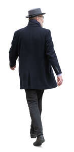 cut out man with a hat and a black overcoat walking