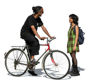 indian man with a bike talking to a female friend
