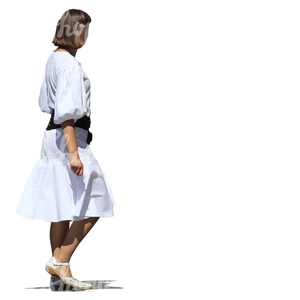 cut out woman in a white dress walking