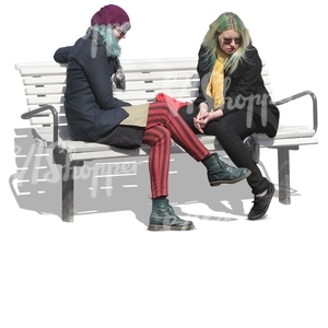 two punk women sitting on a bench