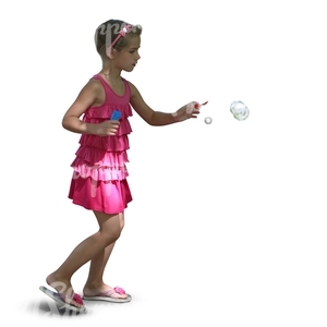 young girl in a pink dress playing with soap bubbles