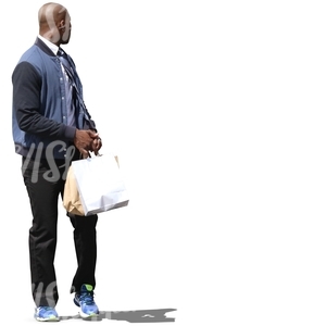 black man walking with shopping bags