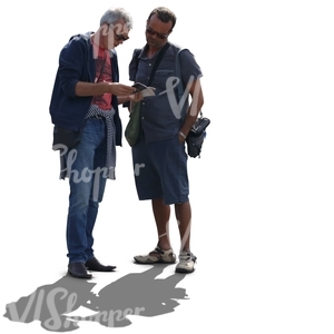 two cut out backlit men standing and reading