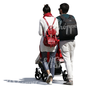 young indian family with a baby carriage walking on the street