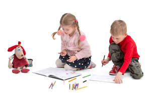 two kids drawing on the floor