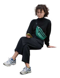 cut out young woman with a phone in her hand sitting