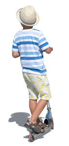 cut out little boy riding a scooter on a summer day