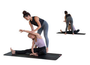 cut out yoga teacher instructing woman at a training