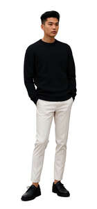 young asian man standing hands in pockets