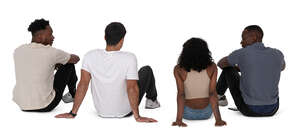cut out group of people sitting on the ground seen from back angle