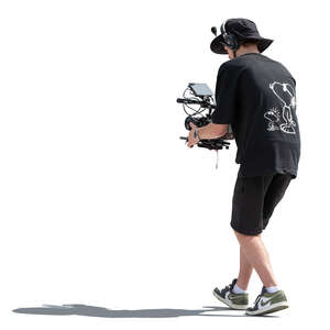 cut out sidelit man with a movie camera filming