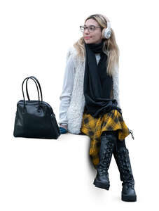 cut out woman with headphones sitting