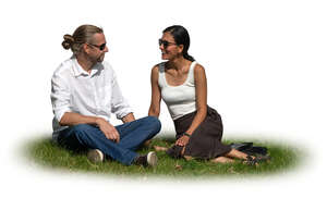 cut out couple sitting on the grass in summer