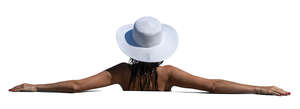 cut out woman with a hat relaxing in the pool
