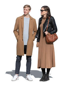 man and woman in autumn standing outside on a sunny day