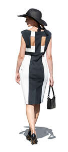 cut out elegant woman in a black and white dress walking