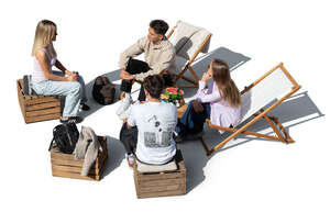 top view of a group of youngsters hanging in a outdoor cafe