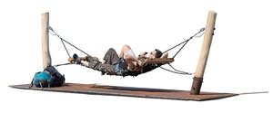 two people lying in an outdoor hammock