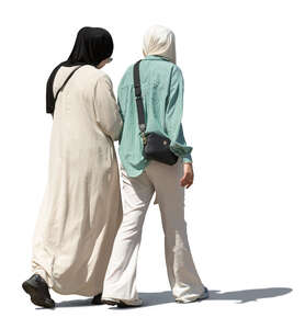 two muslim women walking in the street