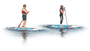 two cut out people on paddle boards