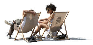 sidelit image of two black people relaxing in sling chairs outside
