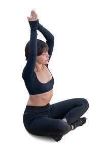 top view of a woman sitting in a yoga pose