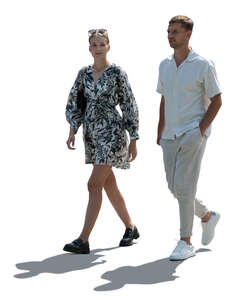 backlit man and woman walking