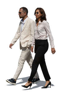 man and woman in formal summer outfits walking