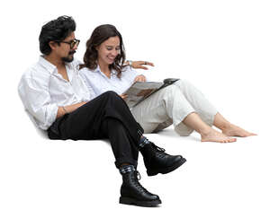 man and woman sitting comfortably on the sofa