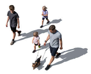 top view of a man with children and a dog walking