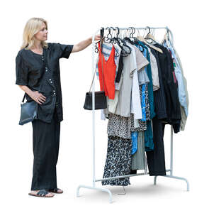 woman at a flea market looking at clothes
