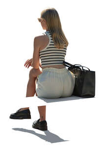 cut out backlit woman sitting seen from back angle