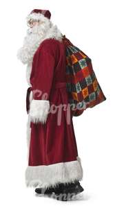 Santa Claus standing with a bag during Christmas