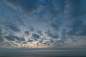 sky with sun low in the horizon