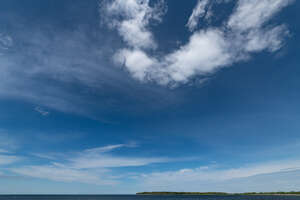 deep blue sky with little white clouds