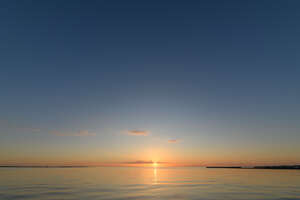 sunset with sun barely above the horizon