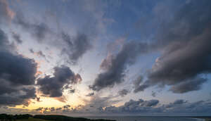 sunset with clouds and pink and yellow sky