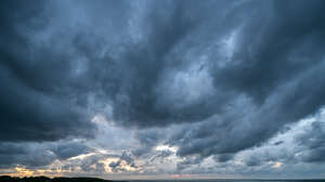 sky with dark grey clouds at dusk