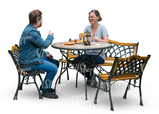 man and woman sitting at a terrace table and drinking coffee