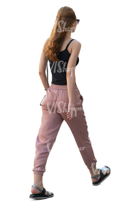 young woman walking hastily