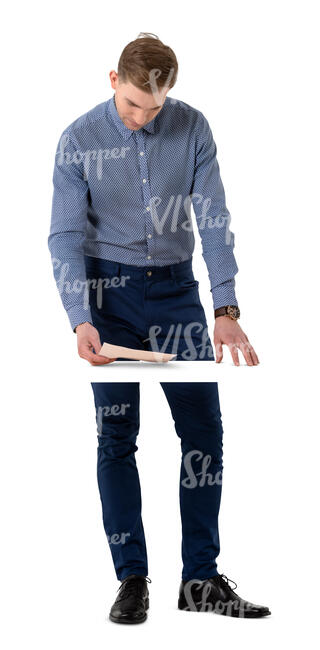 cut out man standing at a table and reading some papers