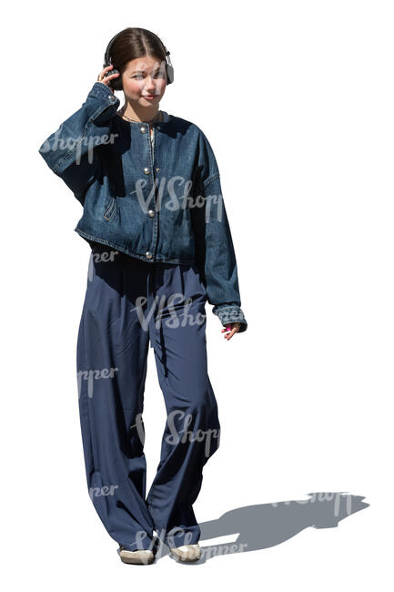 woman with headphones walking