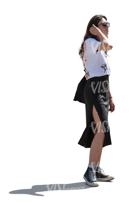 backlit young woman standing