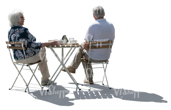 cut out backlit elderly couple sitting in a cafe