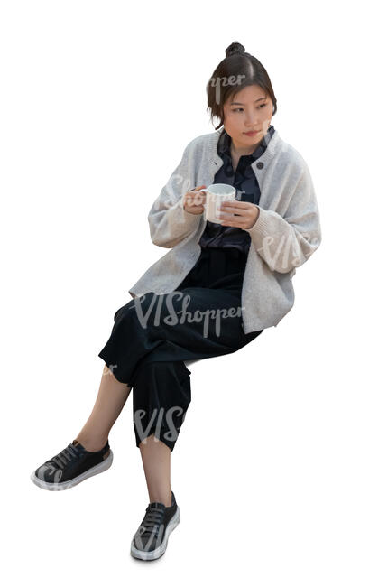 top view of a young asian woman sitting and drinking coffee