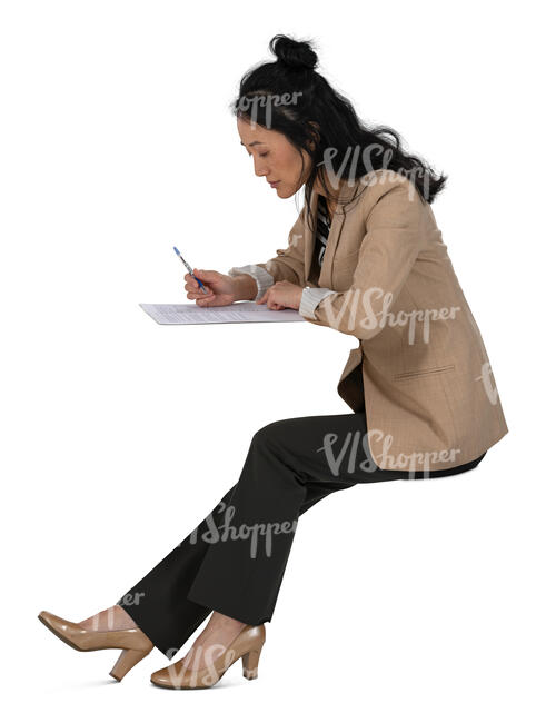 cut out chinese woman sitting behind the desk and writing